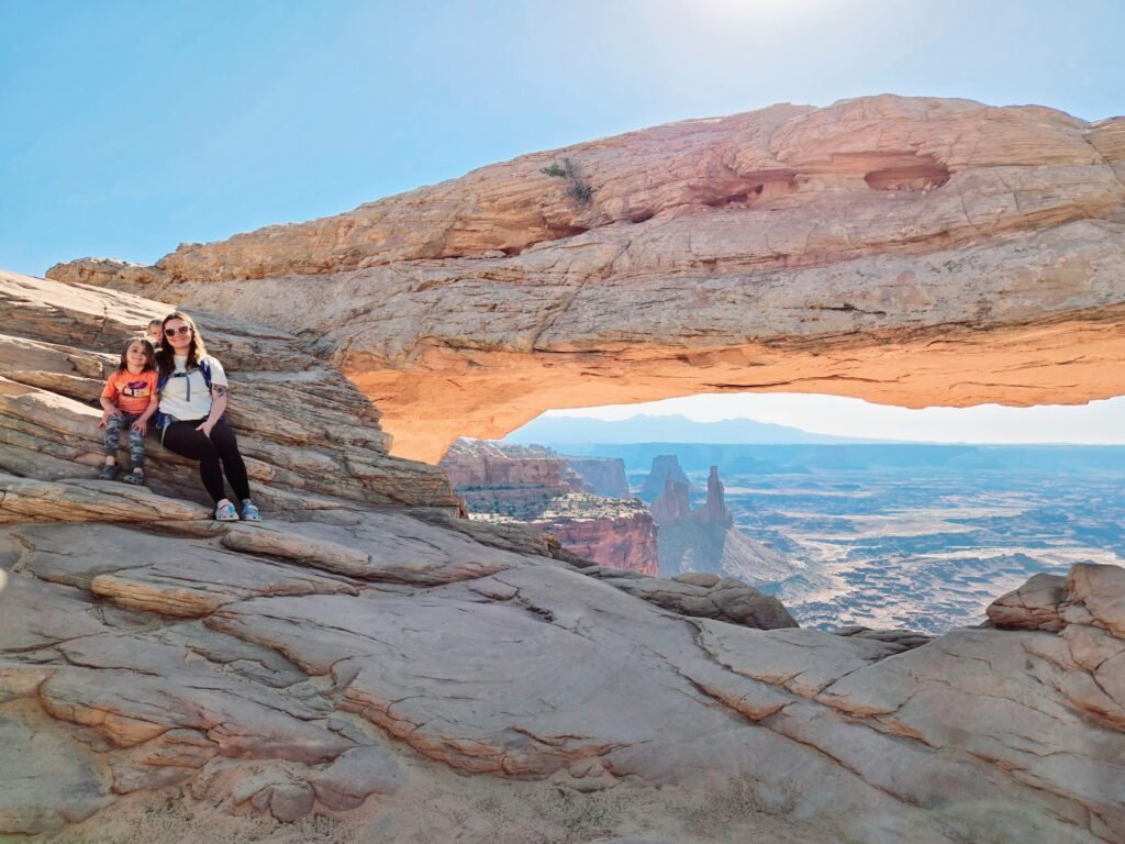 family adventure in canyonlands national park illustrating sustainable travel