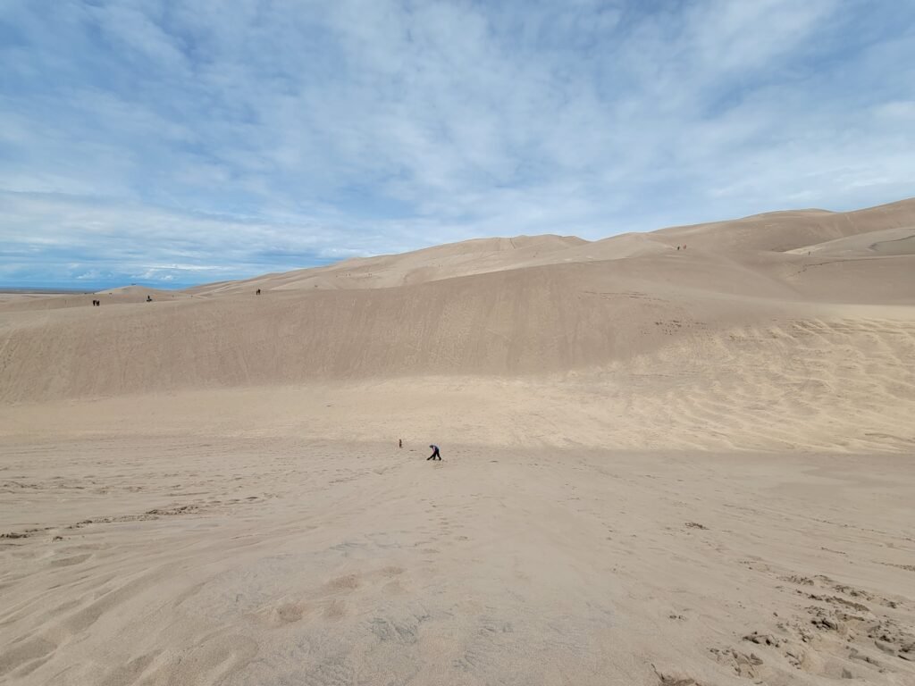 hubby at the bottom of great sand dunes