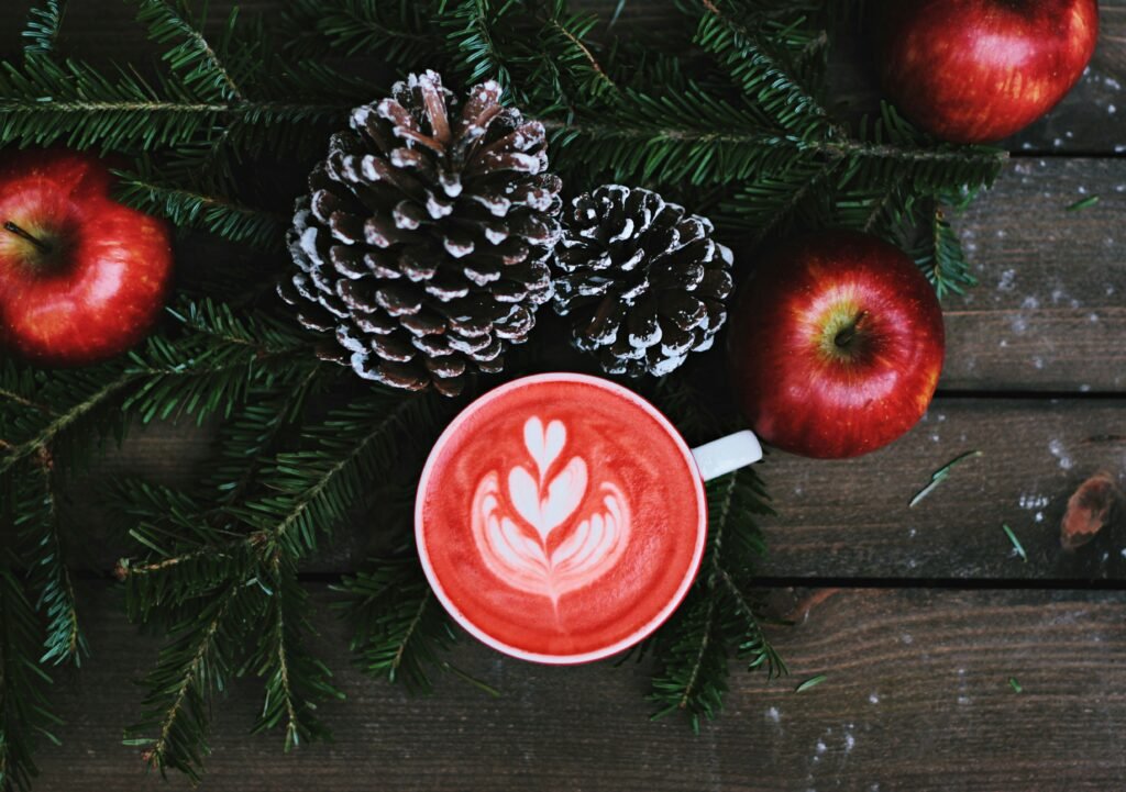 festive pinecone and hot coffee to represent winter in burlington vermont